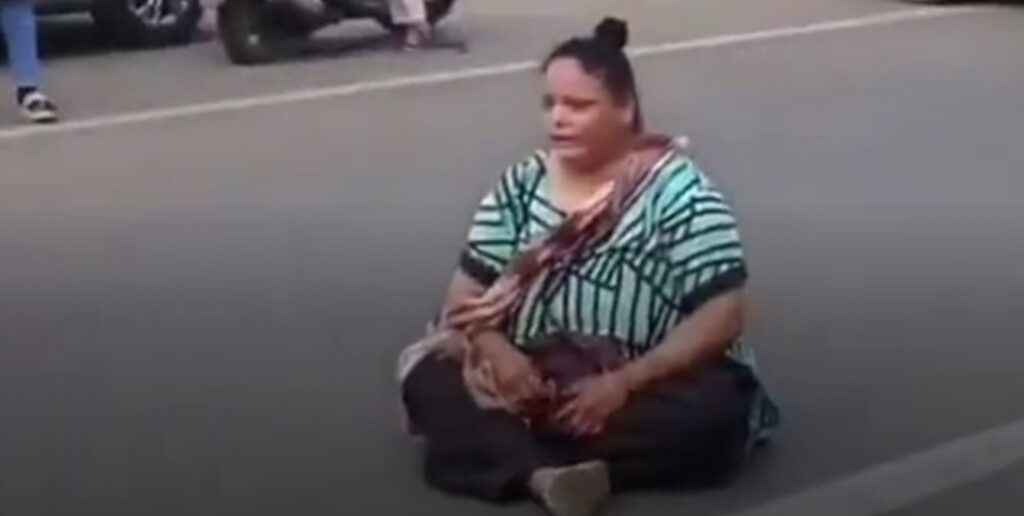 Woman Blocks Road in India